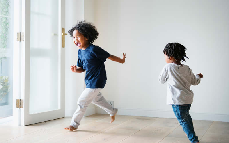 Kids running about their house